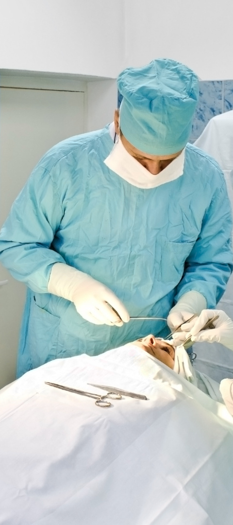 The doctor  perform cosmetology surgical operation